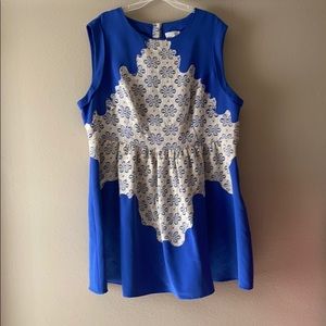 Blue dress with beige/white lace detail.